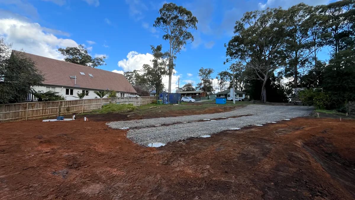 Drainage trench installation on a hillside property in the Dandenong Ranges